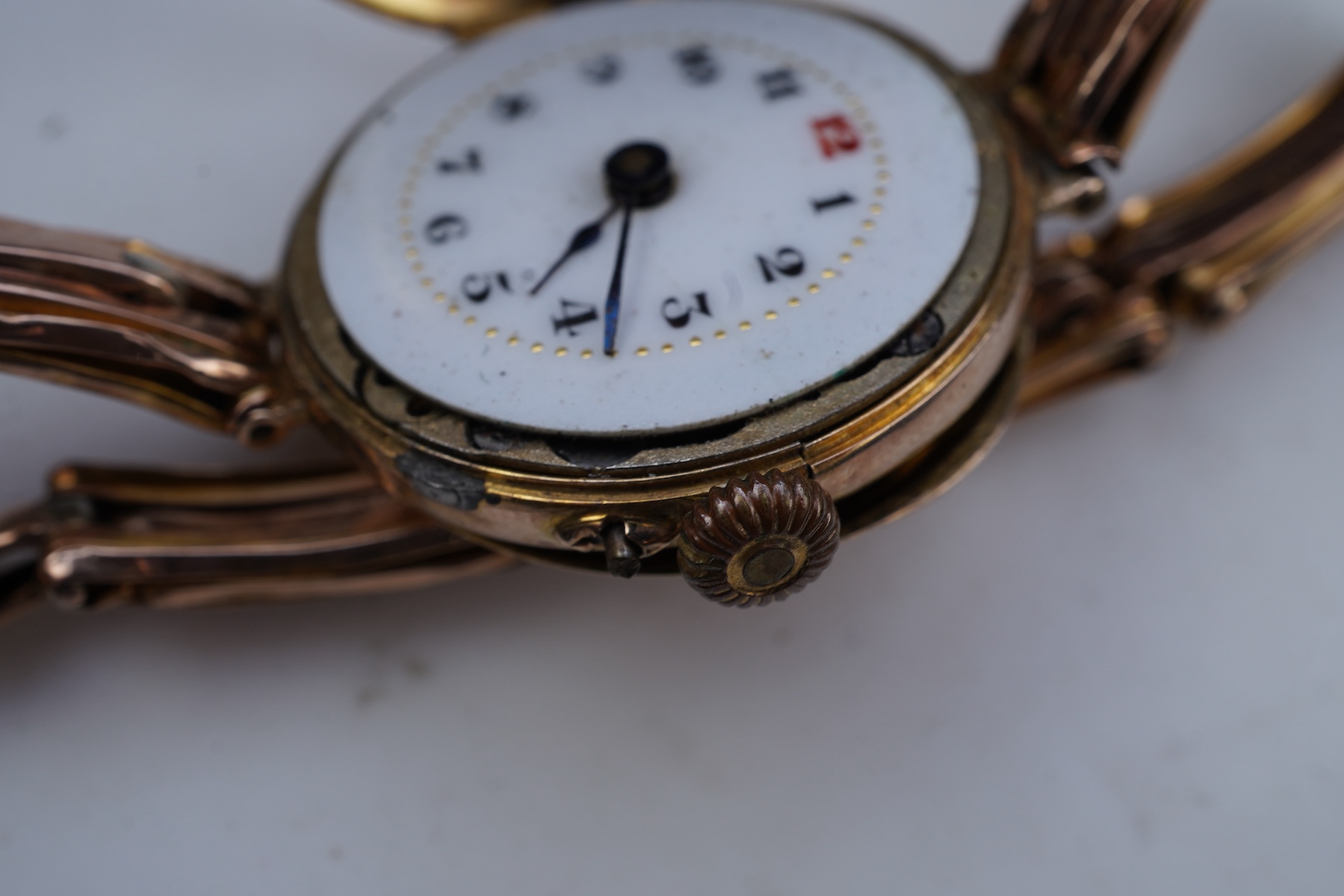 Two gold bracelets and a gold watch